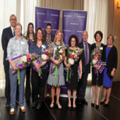 Goeser, center, poses with the other Employee of the Year finalists and University president Morton Shapiro.