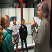 Charlene speaking with girls visiting