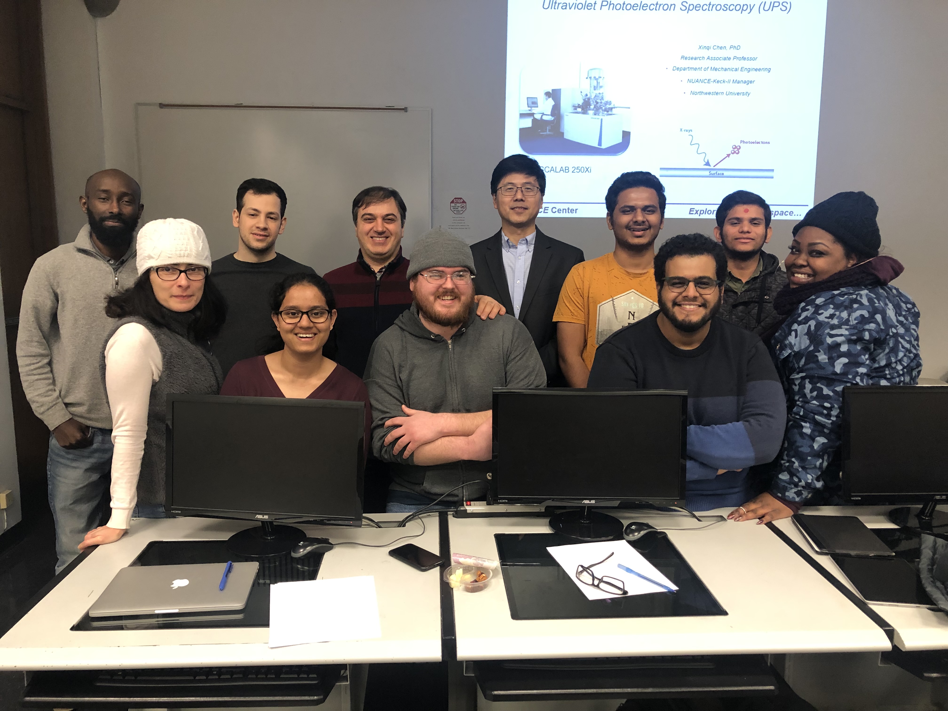 Dr. Chen with poses with the grads