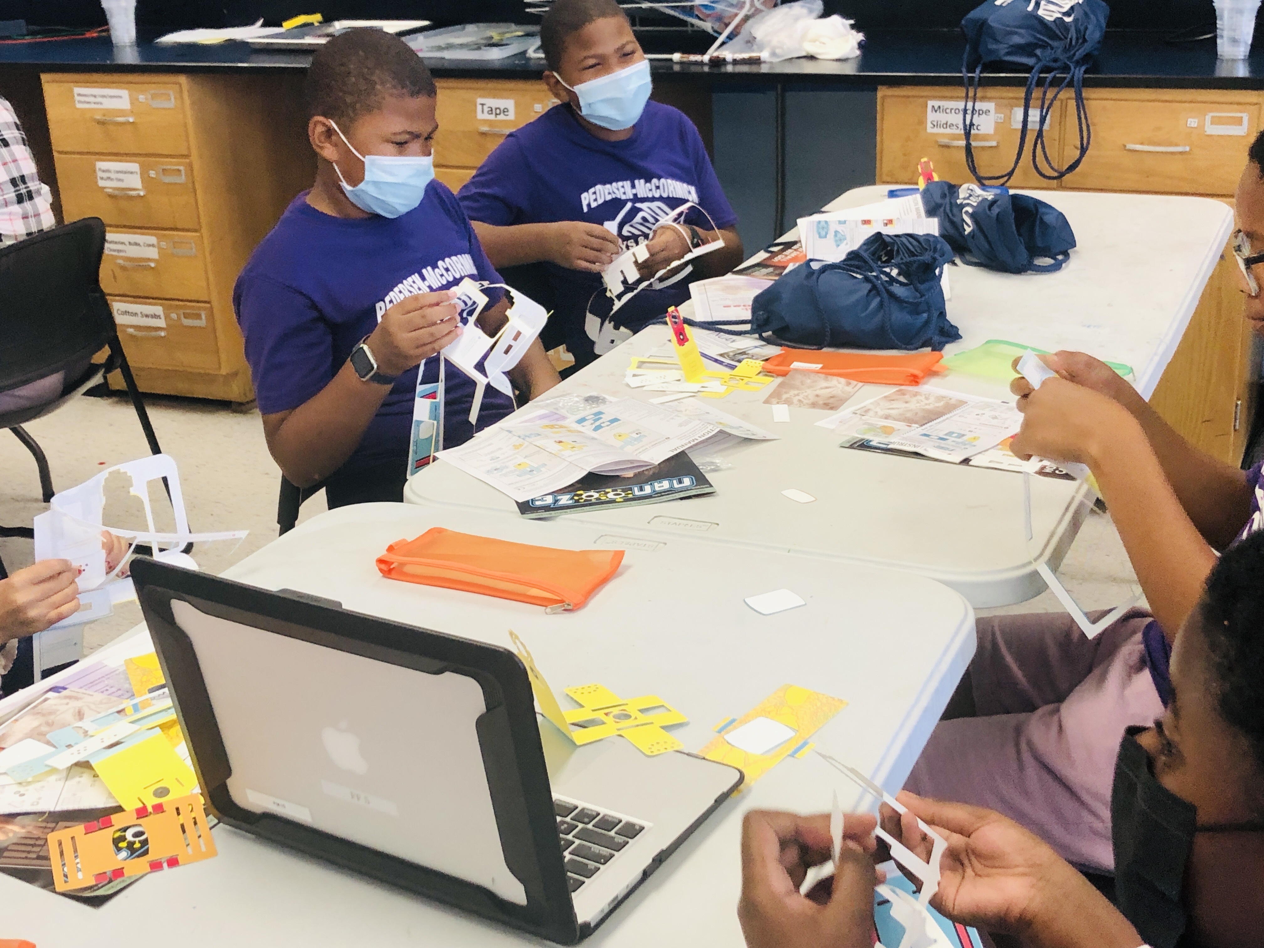 Participants assembling the Foldscopes!